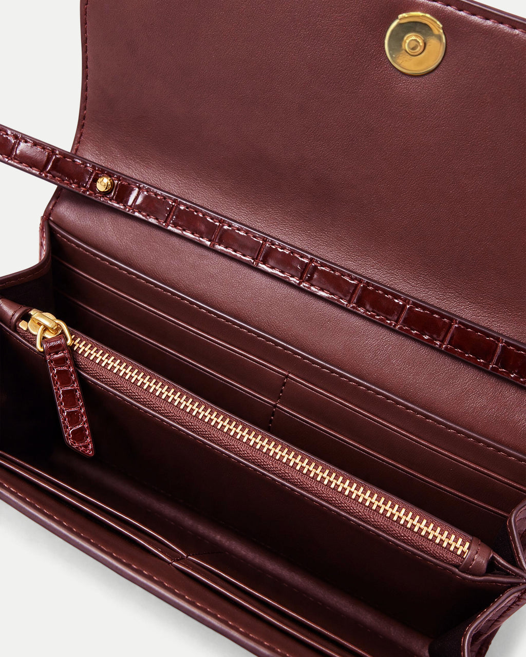 Veronica Beard Burgundy faux-croc textured wallet interior with zipper.