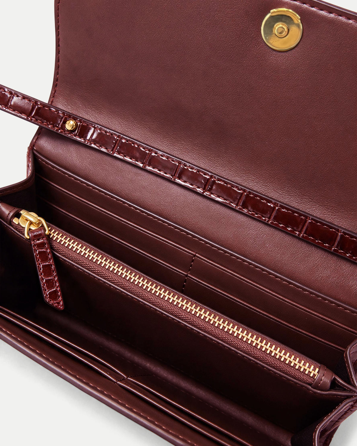 Veronica Beard Burgundy faux-croc textured wallet interior with zipper.