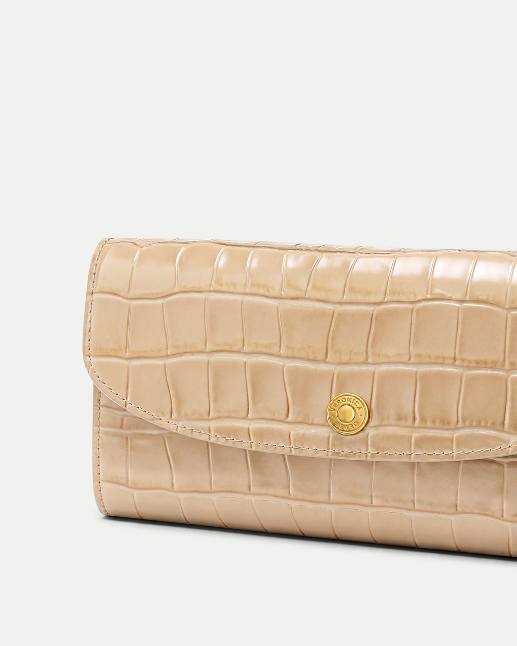 Veronica Beard Beige crocodile-embossed leather wallet with gold snap closure.