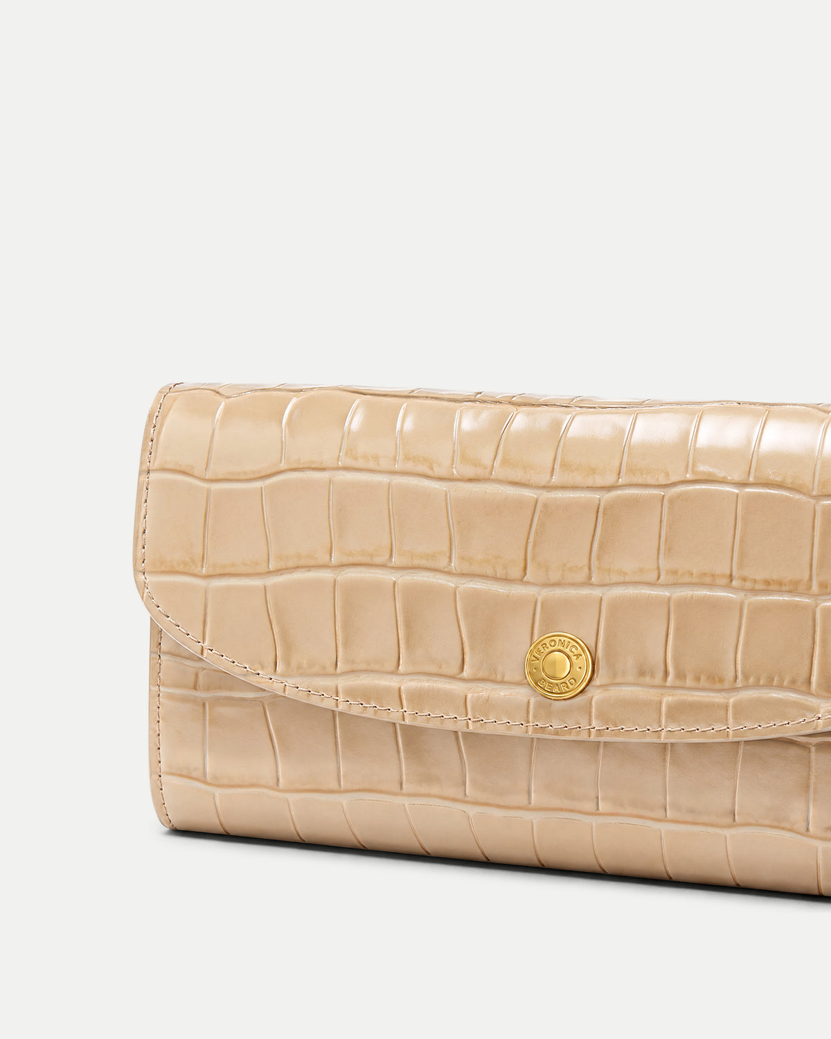 Veronica Beard Beige crocodile-embossed leather wallet with gold snap closure.