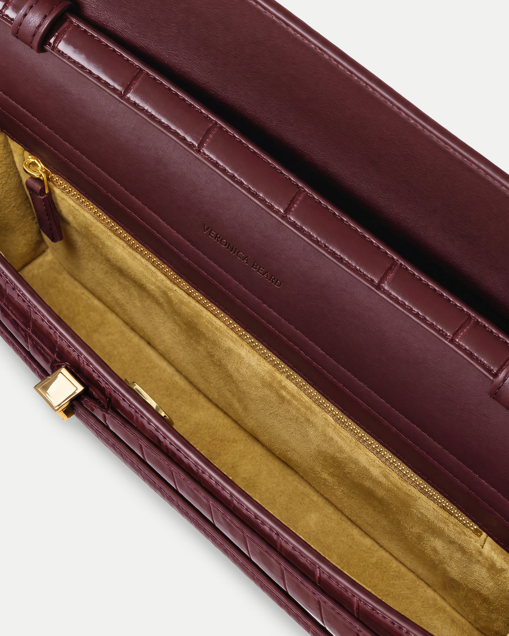 Veronica Beard Burgundy quilted leather structured handbag with gold zipper.