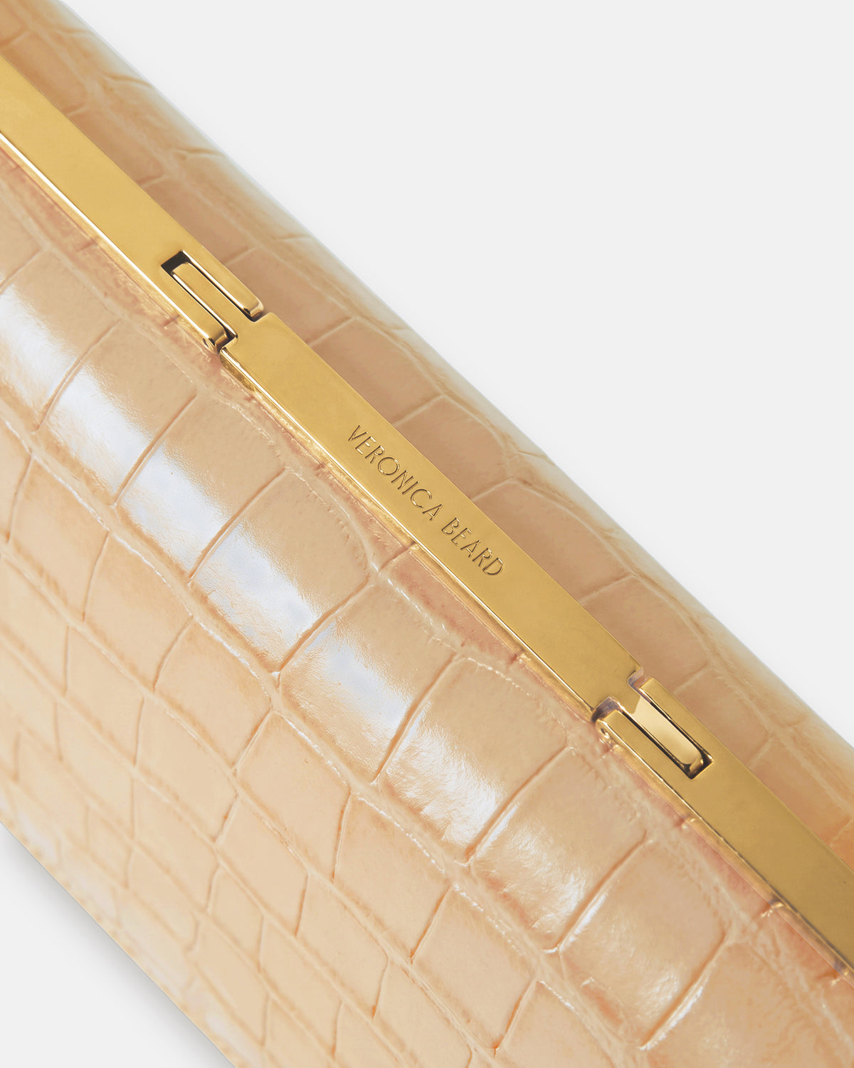 Veronica Beard Beige crocodile embossed leather clutch with gold hardware.