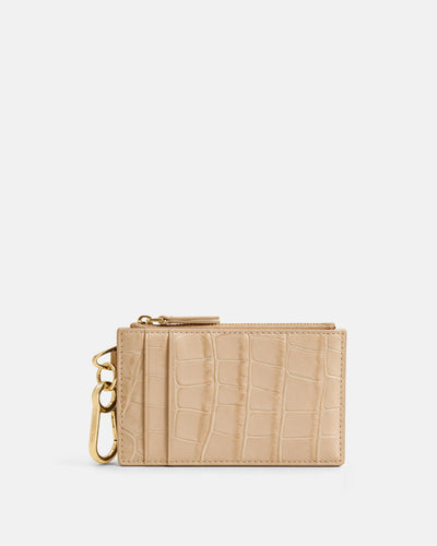 Veronica Beard Beige embossed leather card holder with gold hardware.
