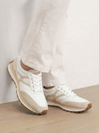 Veronica Beard White leather and suede sneakers with beige accents.