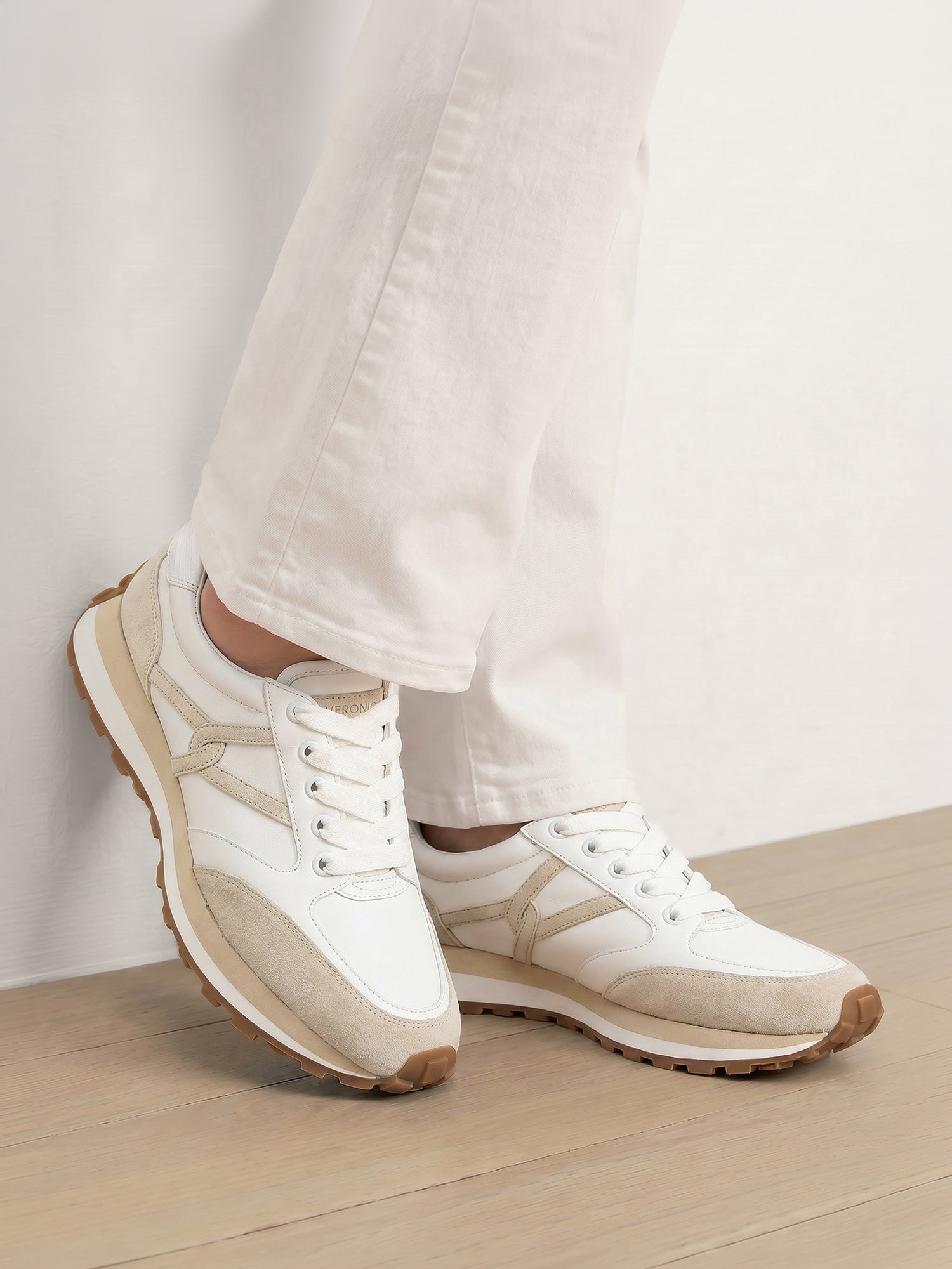 Veronica Beard White leather and suede sneakers with beige accents.