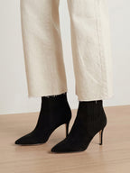 Veronica Beard Black suede pointed-toe ankle boots with mid heels.