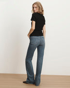 Veronica Beard Black short-sleeve t-shirt and blue flared jeans.