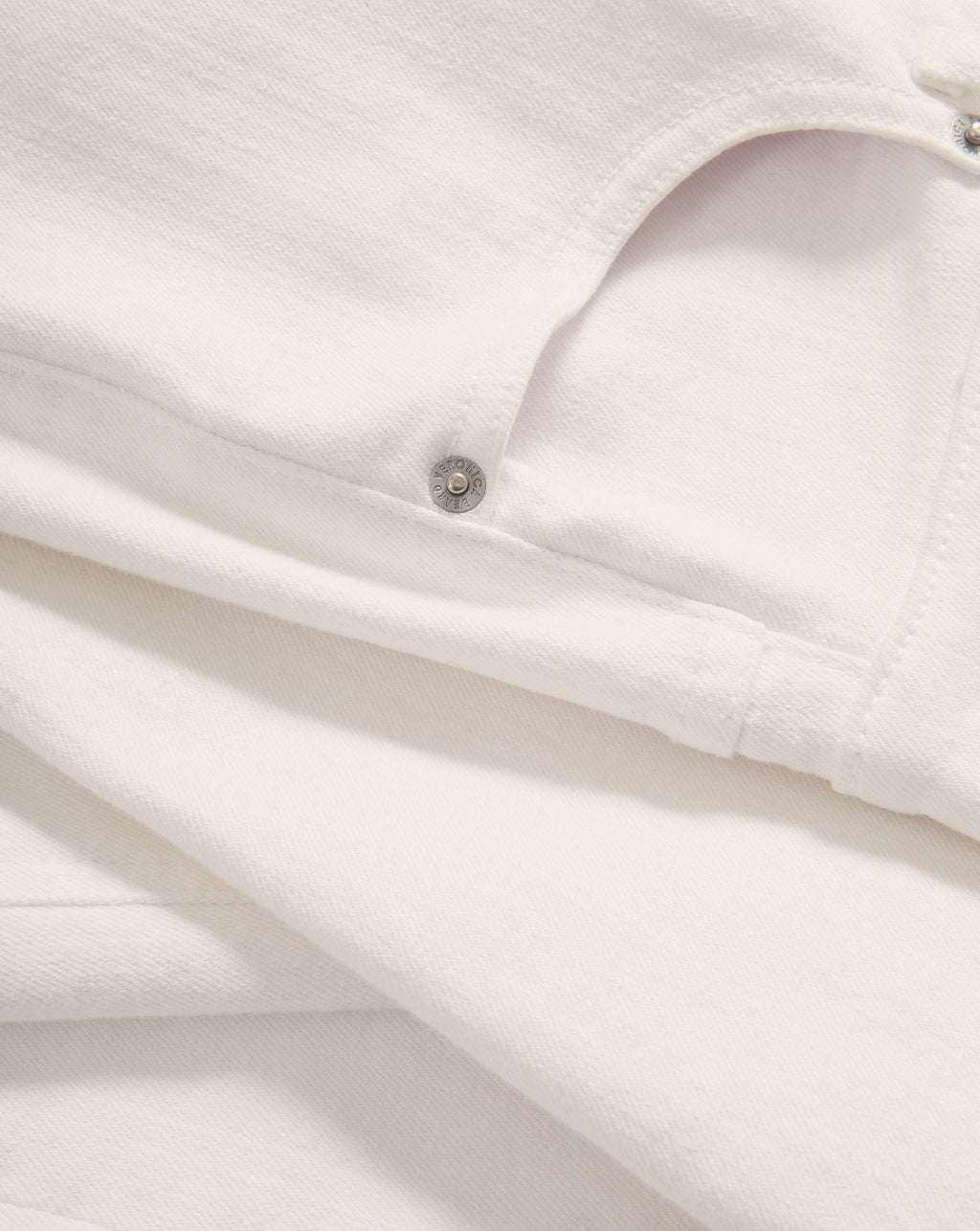 Veronica Beard White denim jeans with a classic five-pocket design and silver-toned hardware.