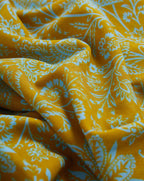 Veronica Beard Mustard yellow fabric with a light blue floral and paisley pattern.
