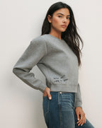 Veronica Beard Gray crewneck sweatshirt with "Why not? Life is short" embroidered on the side.