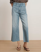 Veronica Beard Light wash wide-leg jeans with front patch pockets and a raw hem.