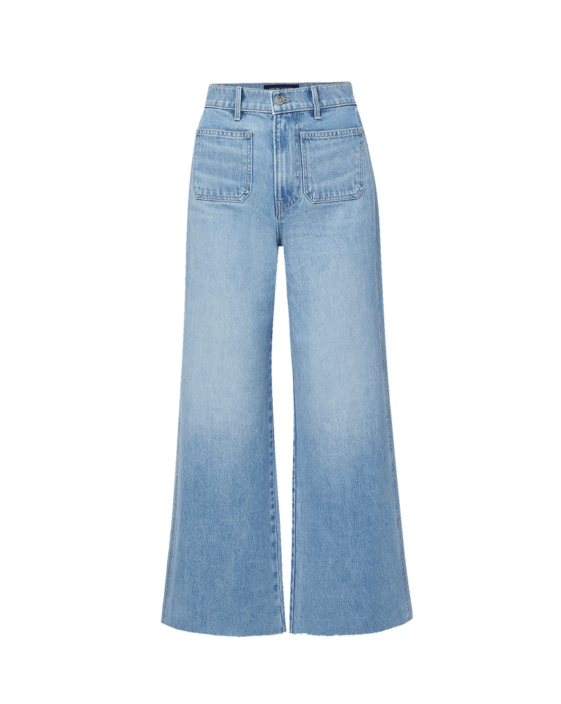 Veronica Beard Light wash denim wide-leg jeans with large front patch pockets.