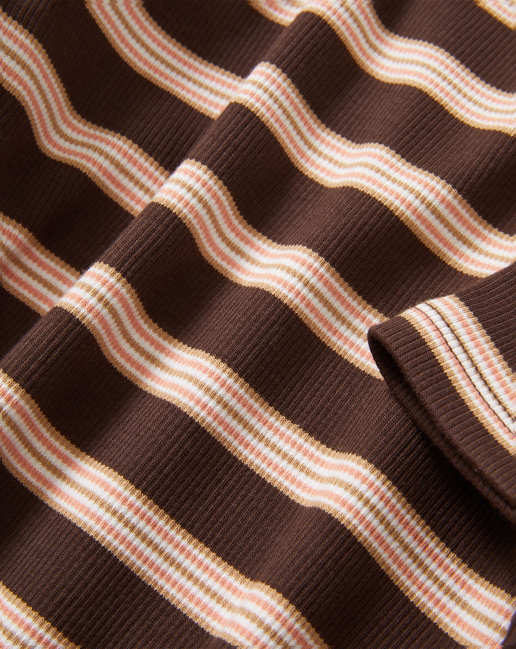 Veronica Beard Brown and pink striped knit t-shirt with light wash wide-leg jeans.