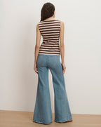 Veronica Beard Brown and pink striped sleeveless knit top with light wash flared jeans.