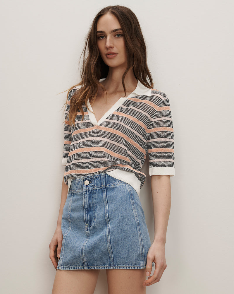 Veronica Beard Striped knit polo shirt with white collar and light wash denim mini skirt.