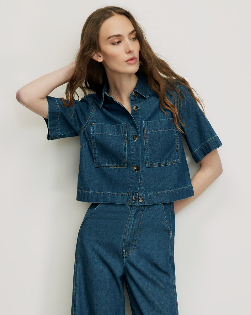 Veronica Beard Blue denim short-sleeve button-up top with pockets.