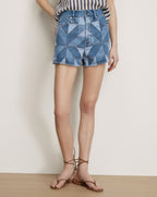 Veronica Beard Blue denim patchwork geometric high-waisted shorts.