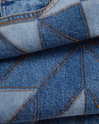 Veronica Beard Blue patchwork jeans with orange stitching.