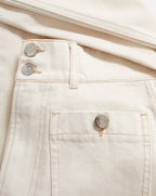 Veronica Beard Cream denim jeans with button fly and patch pocket.