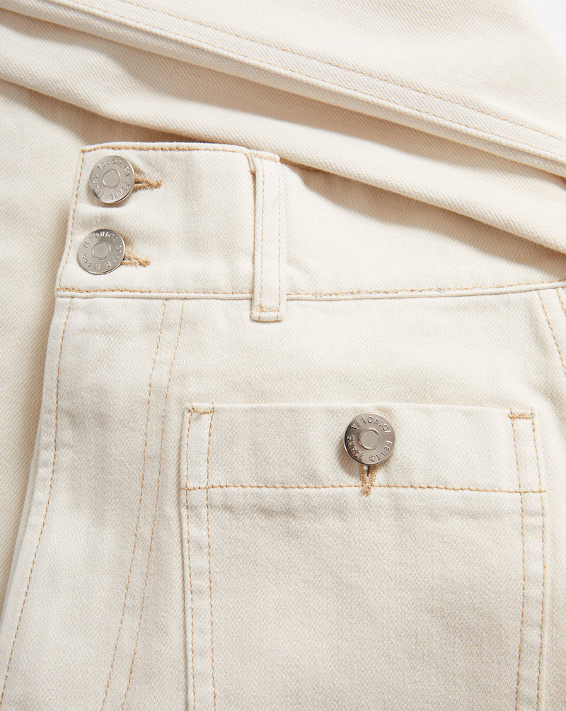 Veronica Beard Cream denim jeans with button fly and patch pocket.
