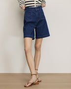 Veronica Beard Dark wash denim shorts with front patch pockets.