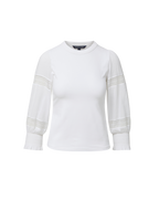 Veronica Beard White long-sleeve top with lace inserts and shirred cuffs.
