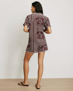Veronica Beard Maroon patterned short-sleeve top with white trim.