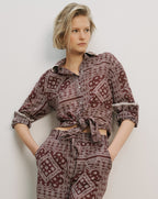 Veronica Beard Maroon paisley print button-up top with tied front.