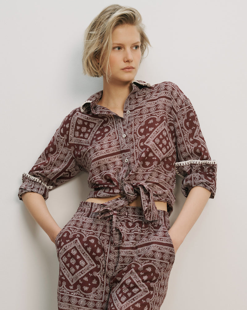 Veronica Beard Maroon paisley print button-up top with tied front.