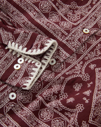Veronica Beard Maroon patterned shirt with white buttons and trim.