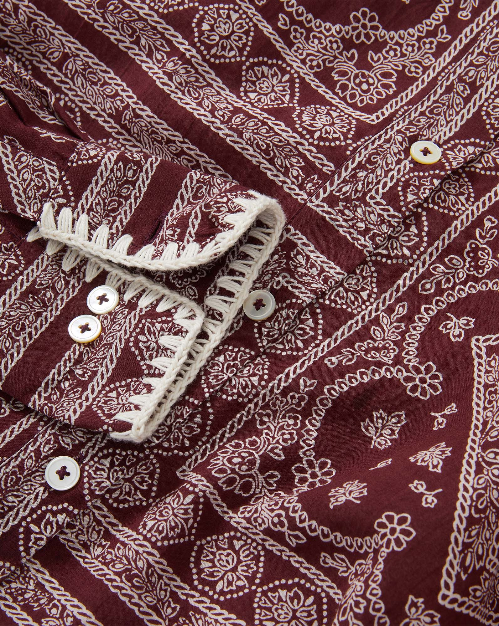 Veronica Beard Maroon patterned shirt with white buttons and trim.
