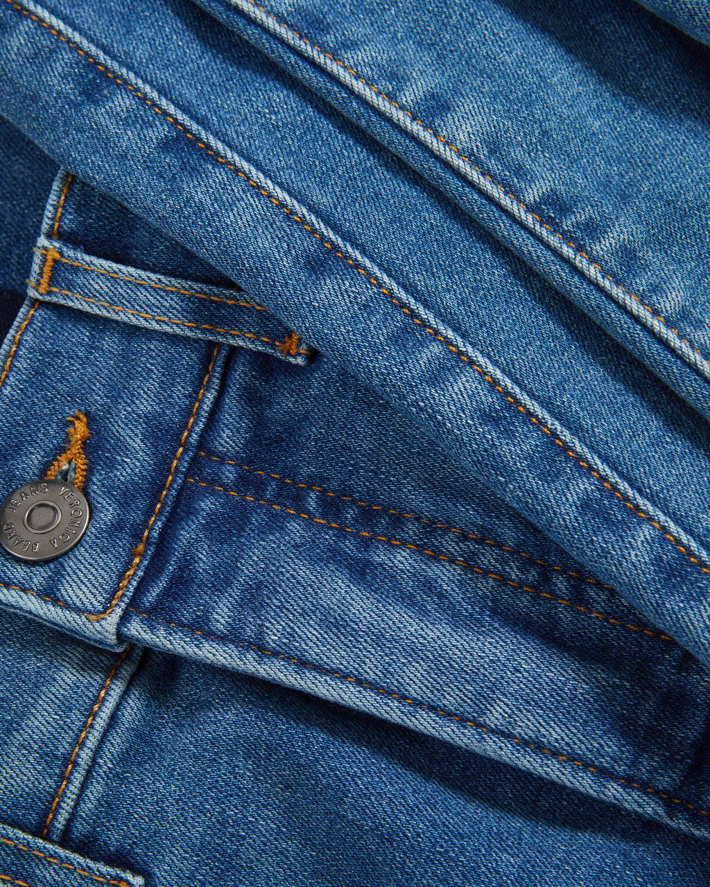 Veronica Beard Blue denim jeans with orange stitching and a metal button.