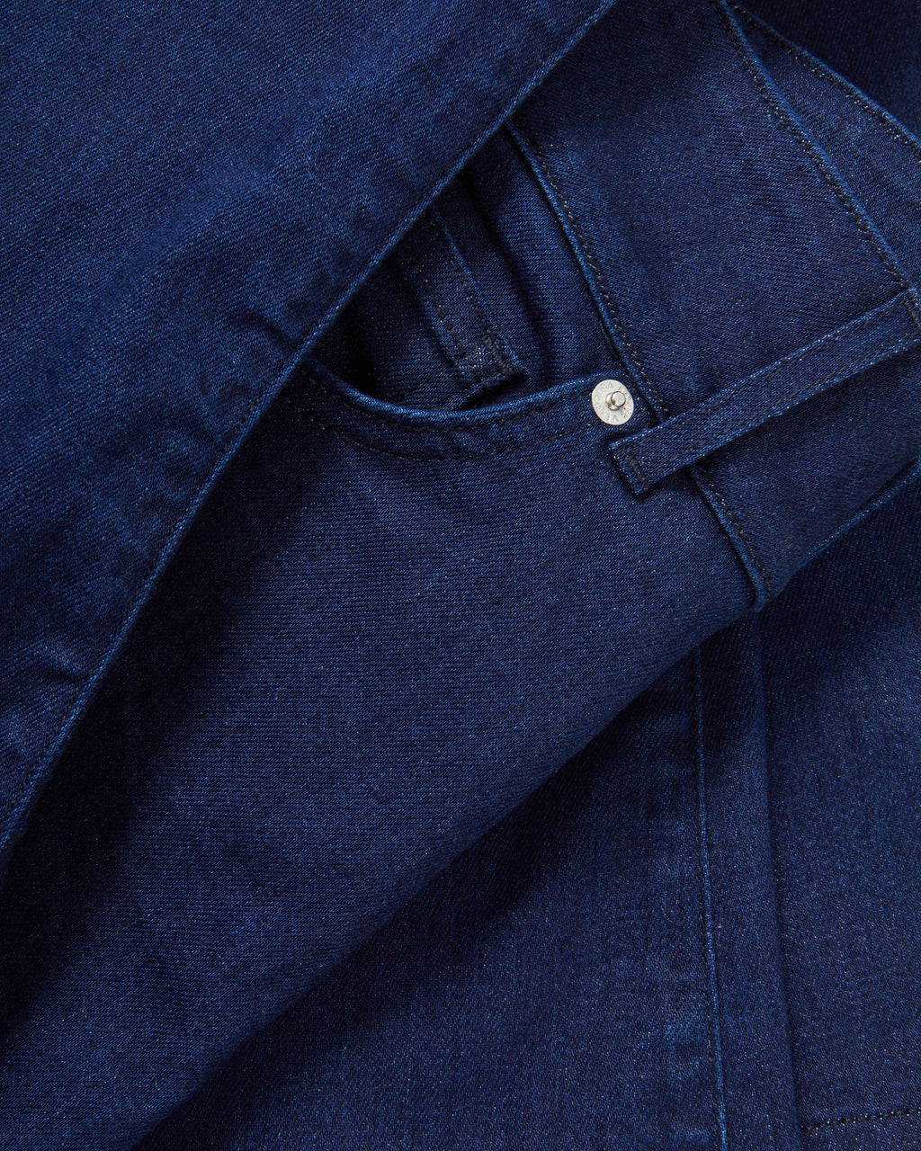 Veronica Beard Dark blue denim jeans with a silver button.