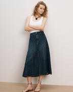 Veronica Beard White tank top, dark wash denim midi skirt.