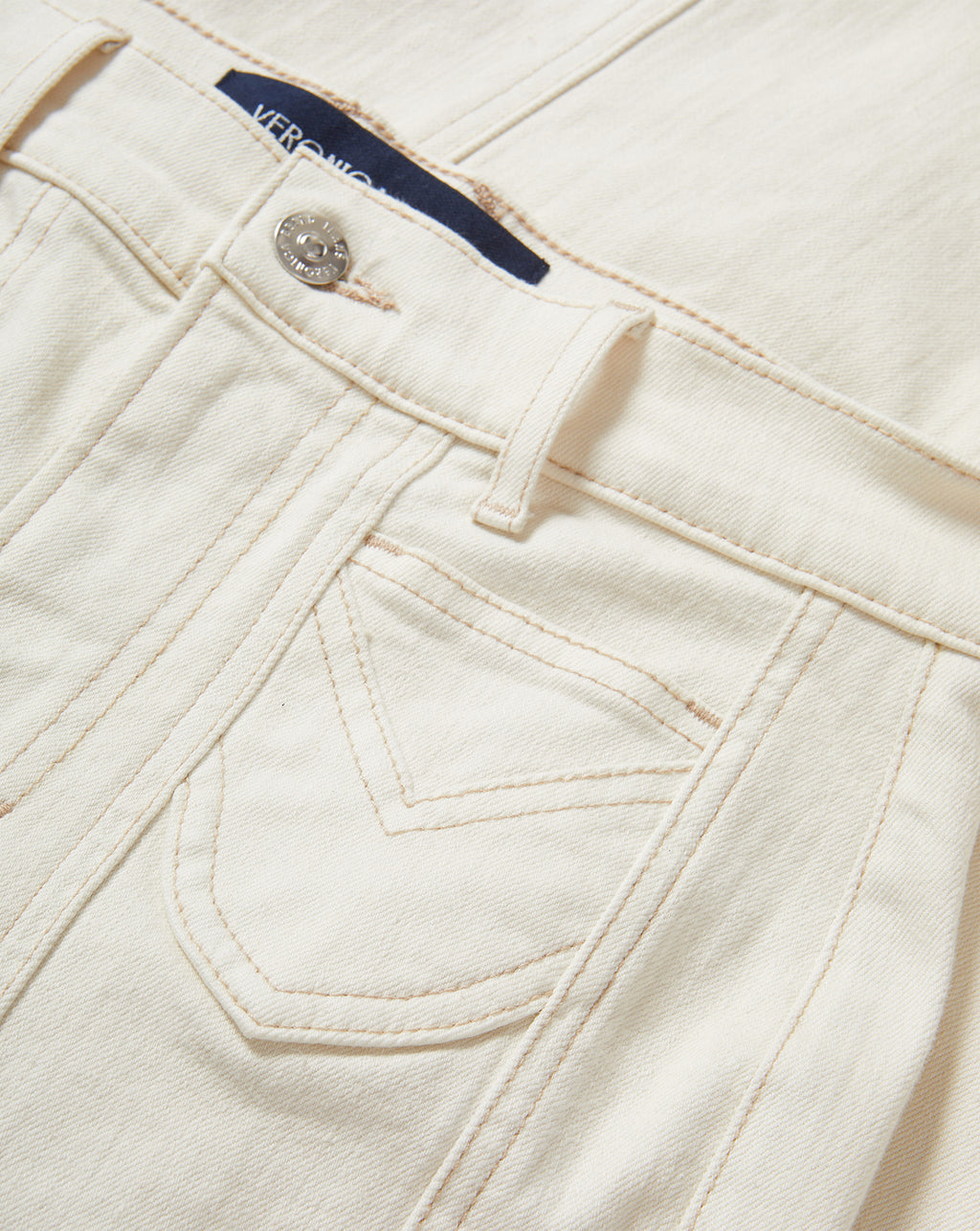 Veronica Beard Cream denim jeans with contrast stitching and front pocket.