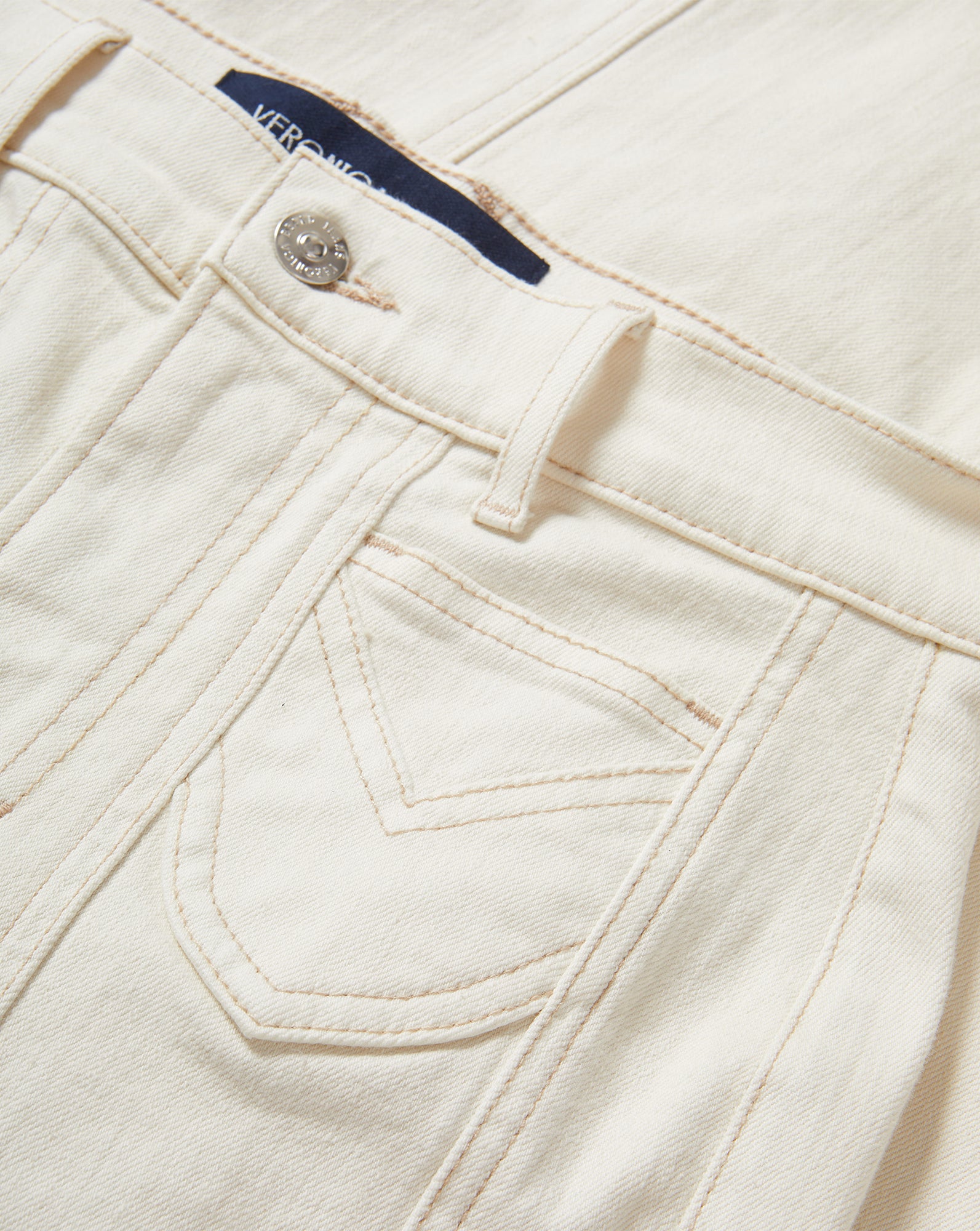Veronica Beard Cream denim jeans with contrast stitching and front pocket.