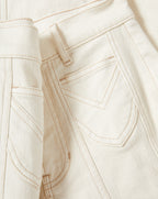 Veronica Beard Cream denim jeans with tan stitching and back pockets.