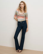 Veronica Beard Striped knit top and dark wash flare jeans.