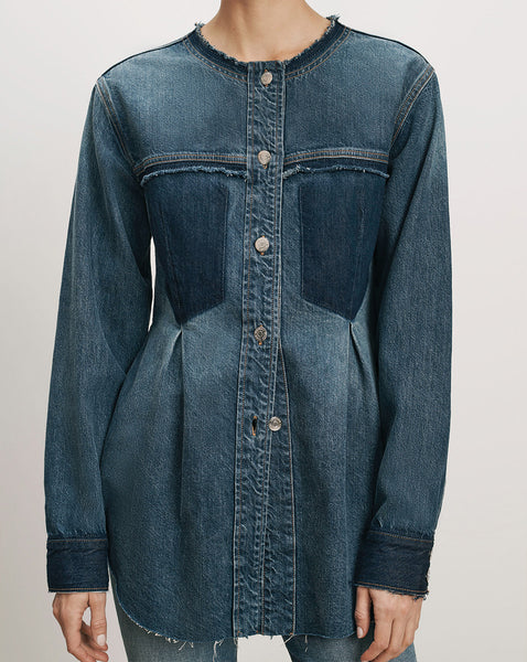 Veronica Beard Blue denim button-down shirt with raw-edge detailing.