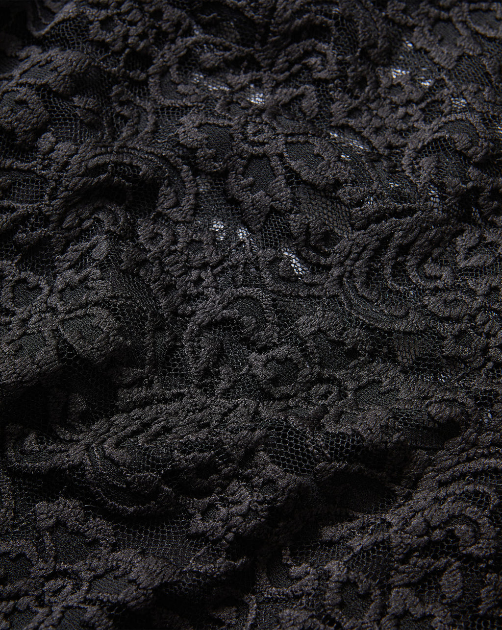 Veronica Beard Black lace fabric with intricate floral pattern.