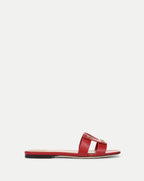 Veronica Beard red leather sandal with a simple, minimalist design is the sole focus of the image, set against a plain white background.