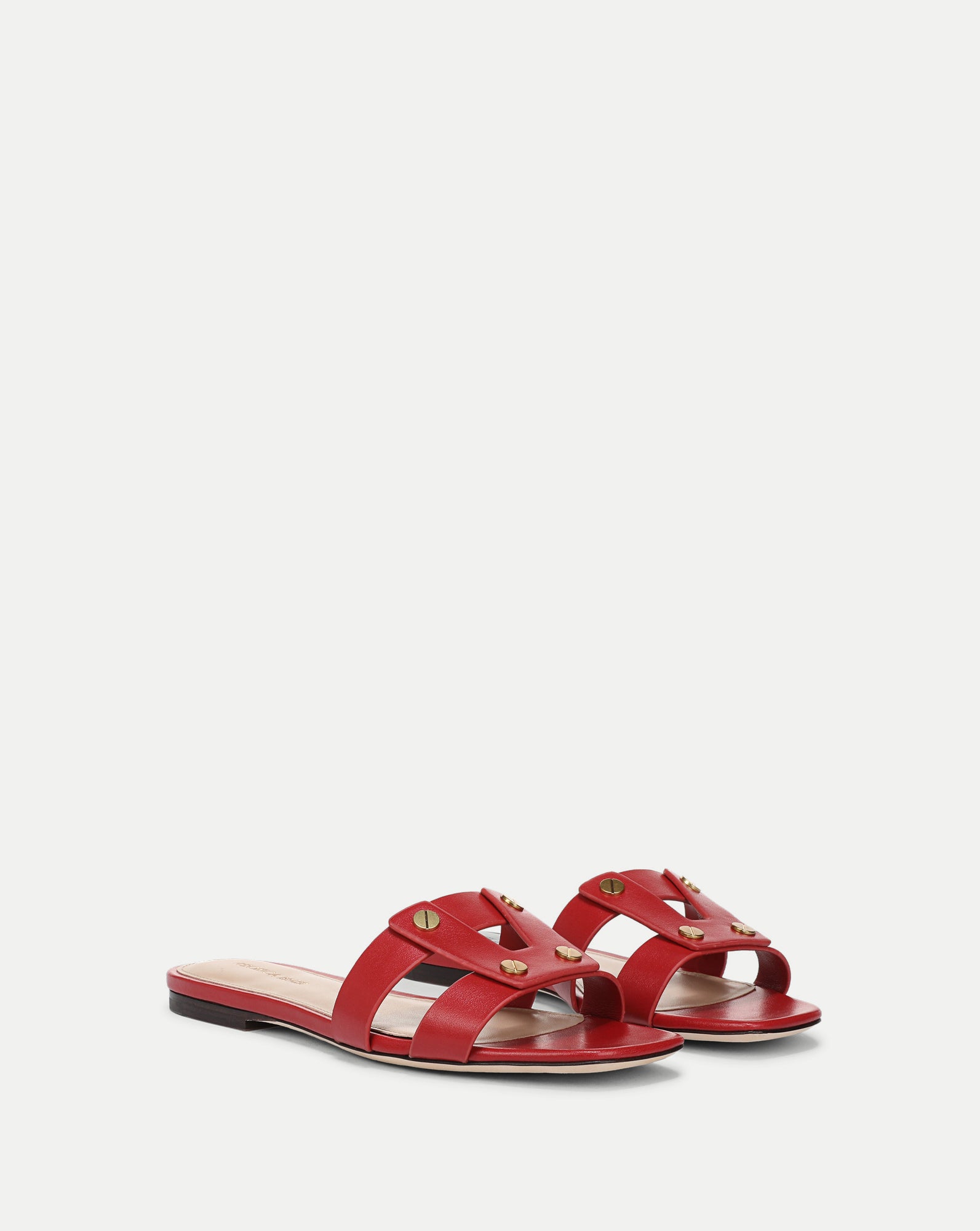 Veronica Beard red leather sandal with a simple, minimalist design is the sole focus of the image, set against a plain white background.