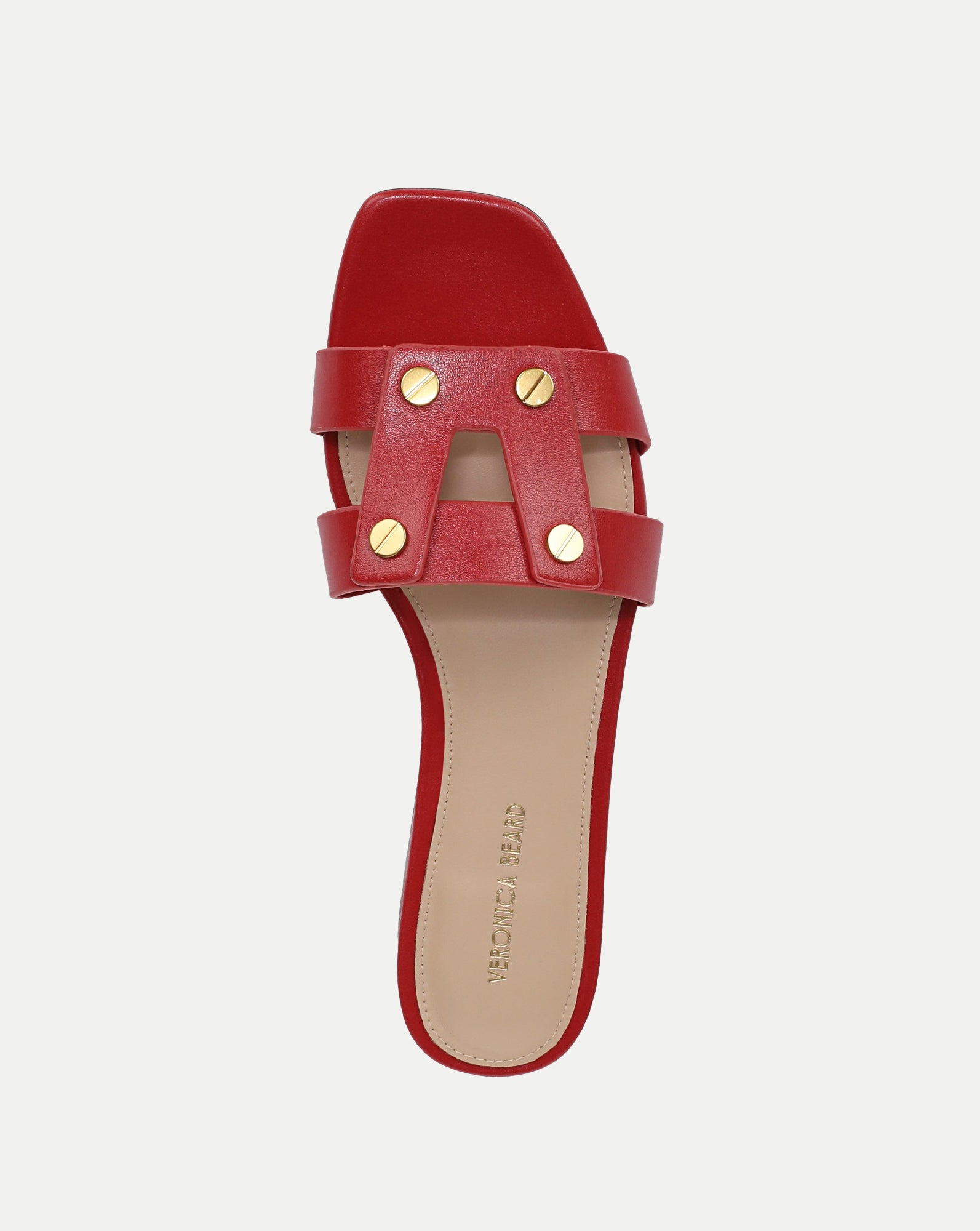 Veronica Beard red leather sandal with a simple, minimalist design is the sole focus of the image, set against a plain white background.