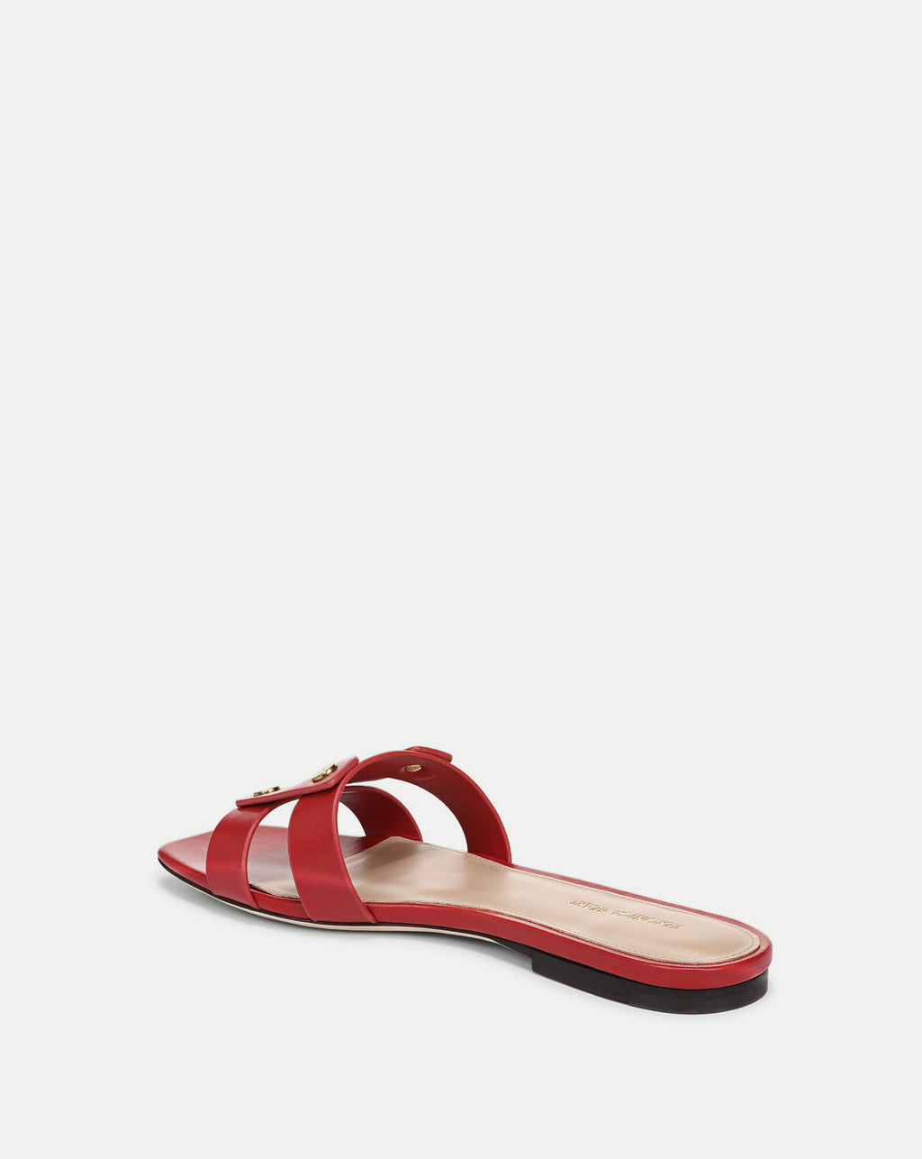 Veronica Beard red leather sandal with a simple, minimalist design is the sole focus of the image, set against a plain white background.