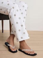 Veronica Beard White embroidered floral jeans with cropped straight leg.