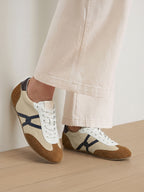 Veronica Beard Beige and brown suede sneakers with navy blue stripes.