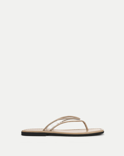 Veronica Beard Beige flat thong sandals with clear vinyl straps.