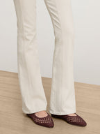 Veronica Beard Off-white flare denim jeans with seam details.