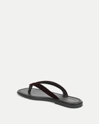 Veronica Beard Black leather sandal with a dark red velvet strap.
