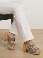 Veronica Beard Taupe suede buckled clogs with wooden heels.